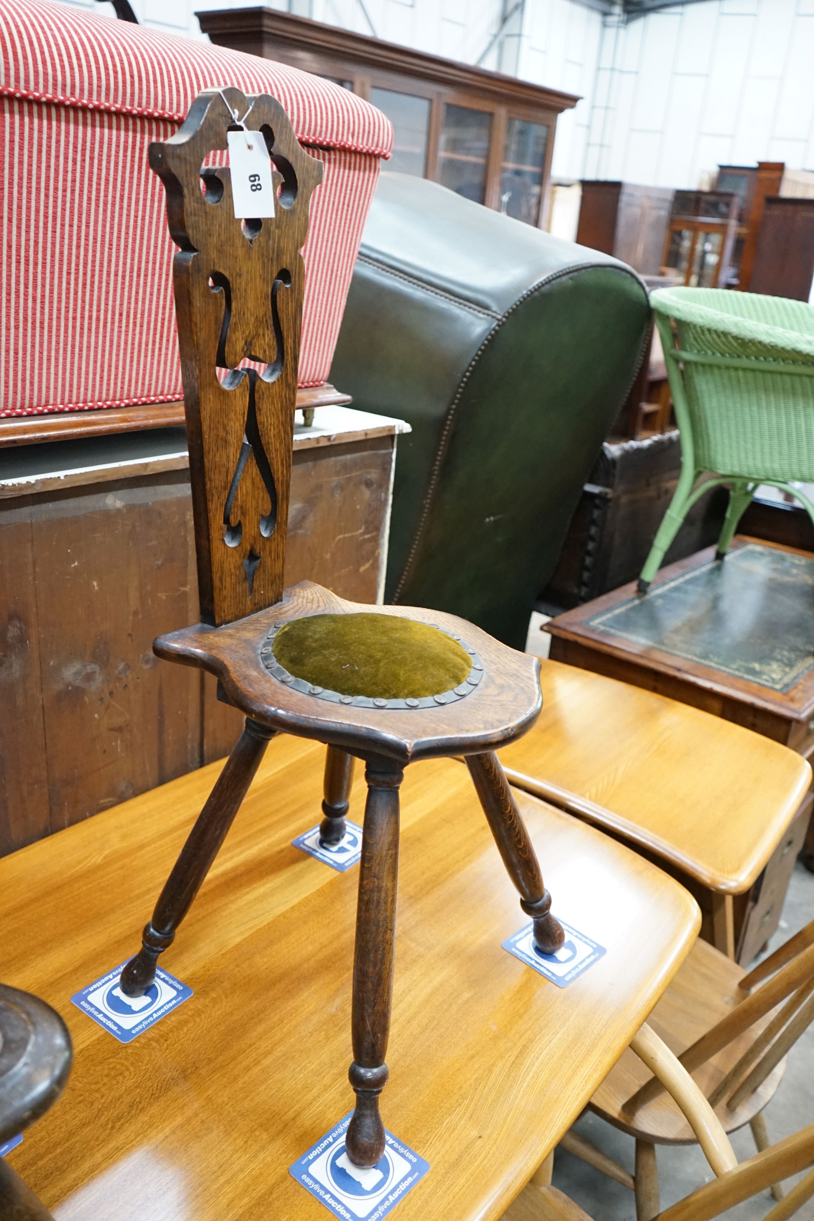 Two carved oak and beech spinning chairs